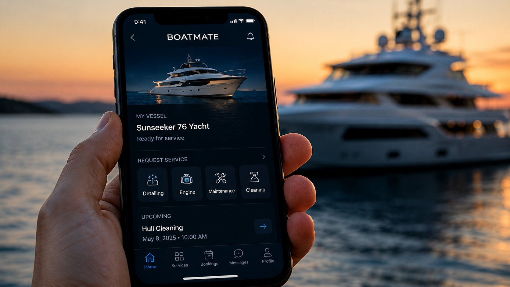 BoatMate app shown on a phone in front of a yacht